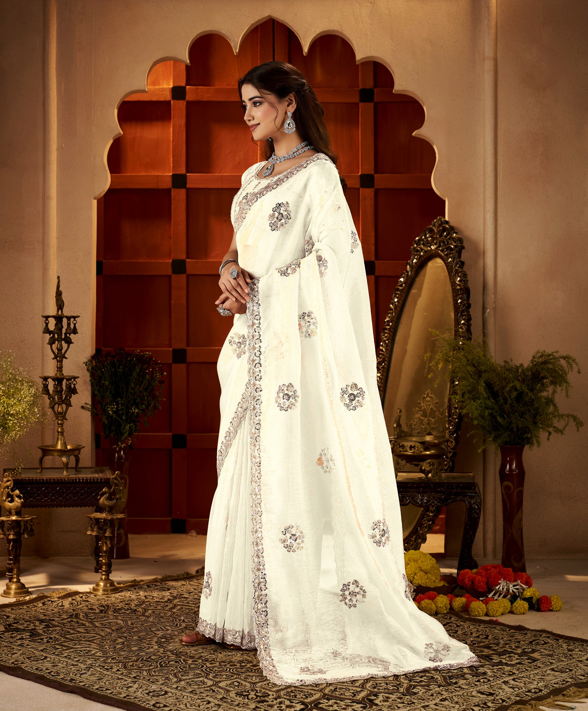chhoga ivory white floral motif saree side profile highlighting graceful drape