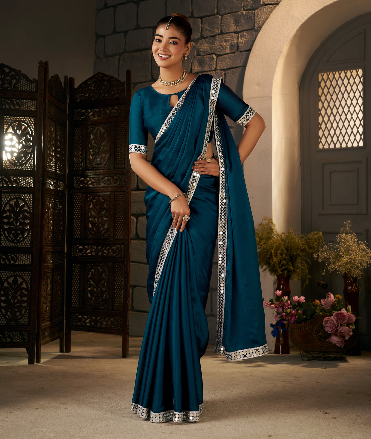 silver mirror embellished border detail on peacock blue ethnic saree