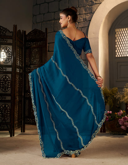 Detailed pallu of the Peacock Blue Gold Stonework Designer Saree with intricate gold stonework.