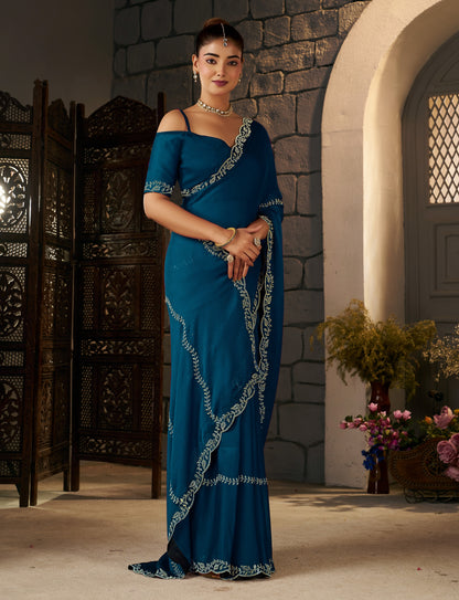 Side profile of the Peacock Blue Gold Stonework Designer Saree with gold stonework border.