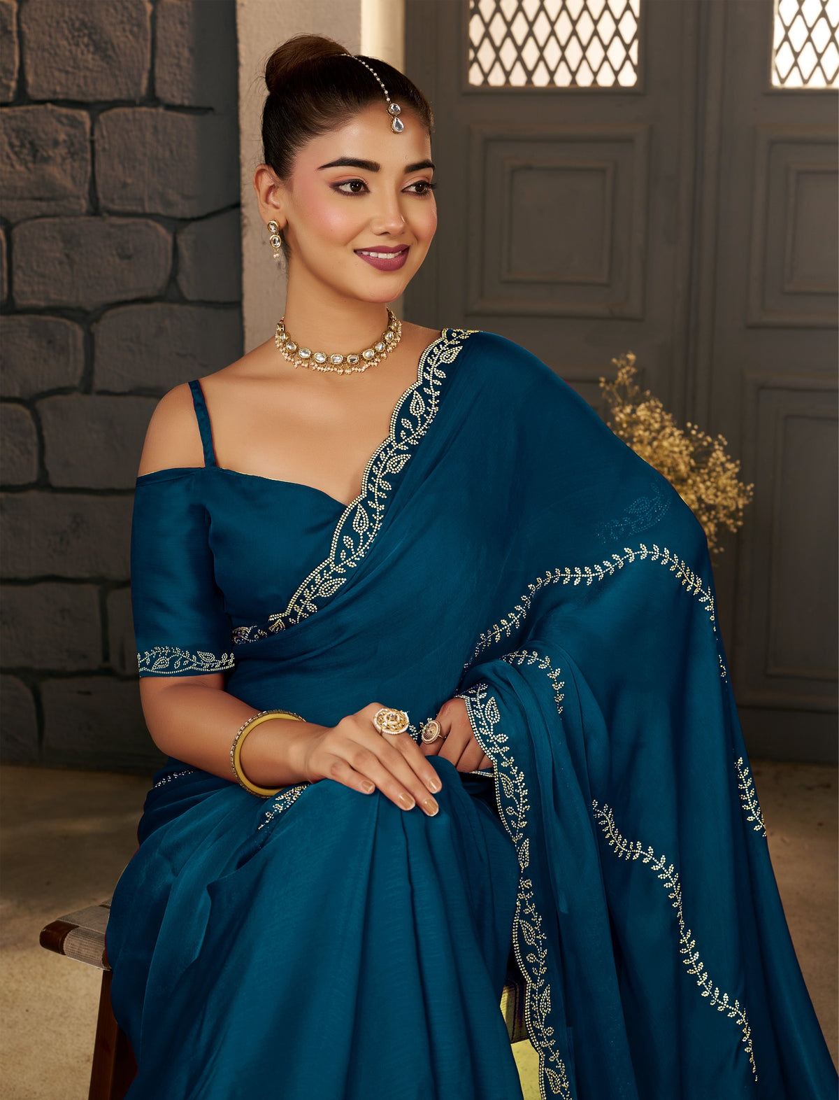 Wedding look featuring the Peacock Blue Gold Stonework Designer Saree by Chhoga.