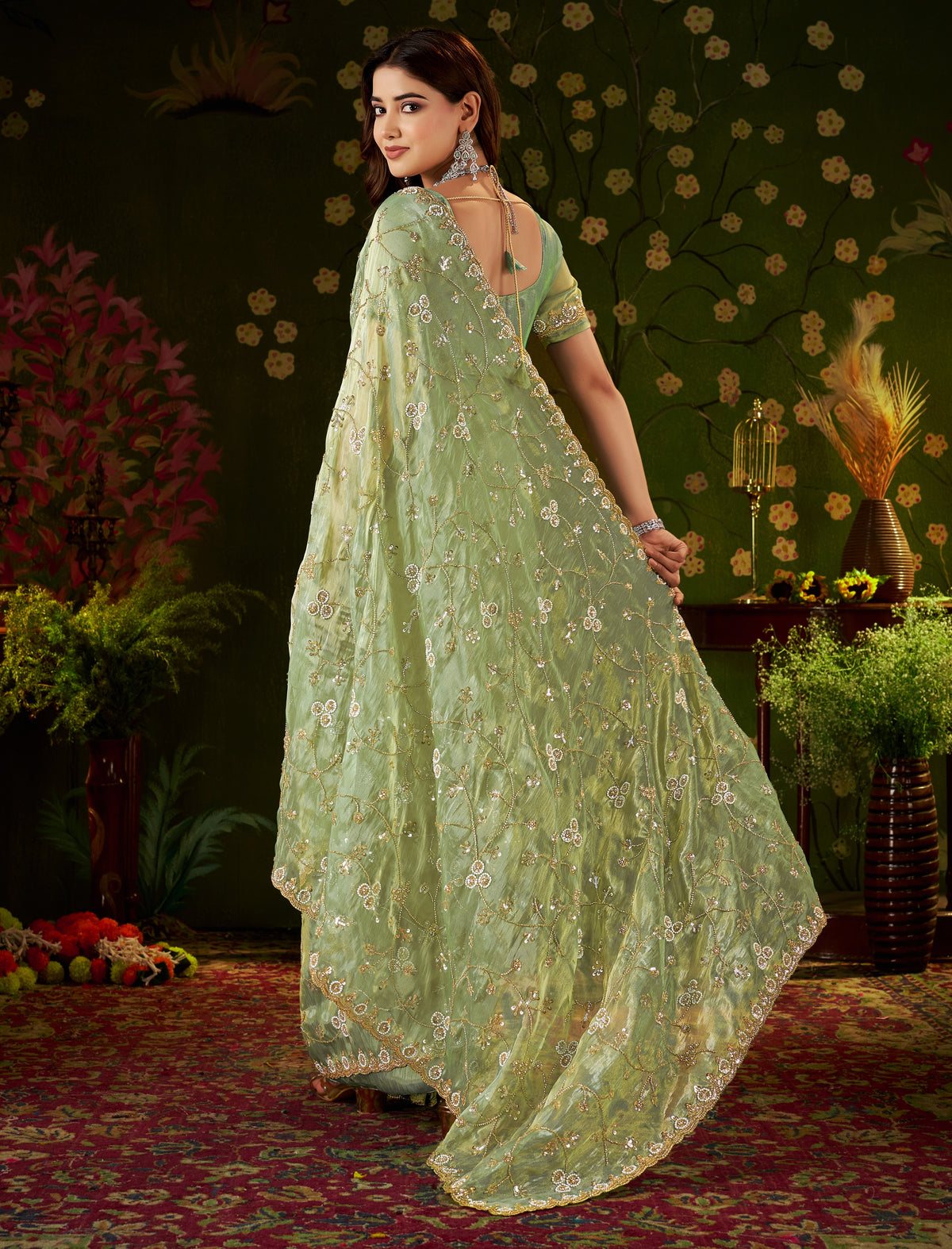 Detailed pallu of Chhoga Pistachio Green Tissue Silk Saree with floral vine hand work and bead embellishments