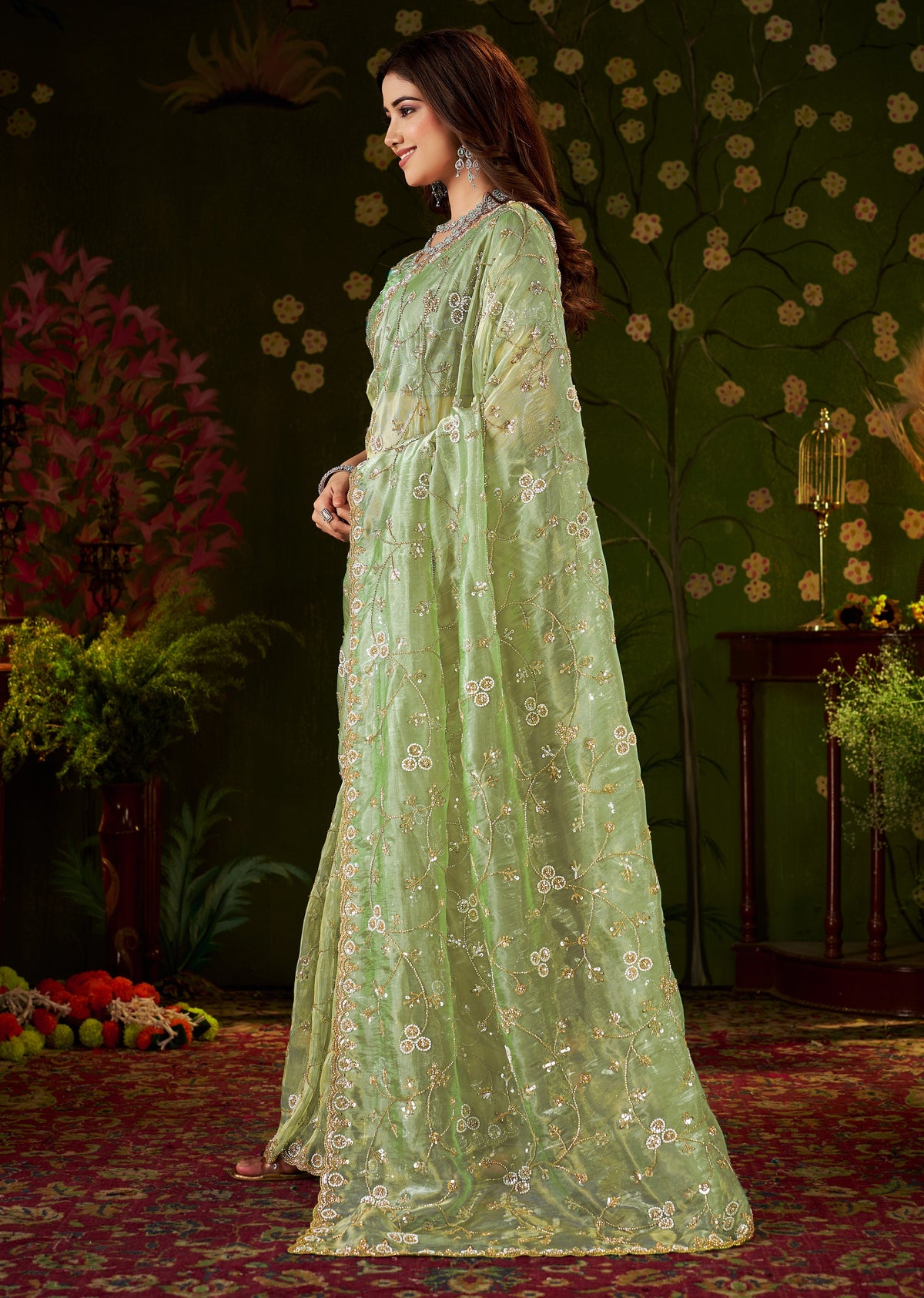 side view of chhoga pistachio green tissue silk saree with embellished floral design