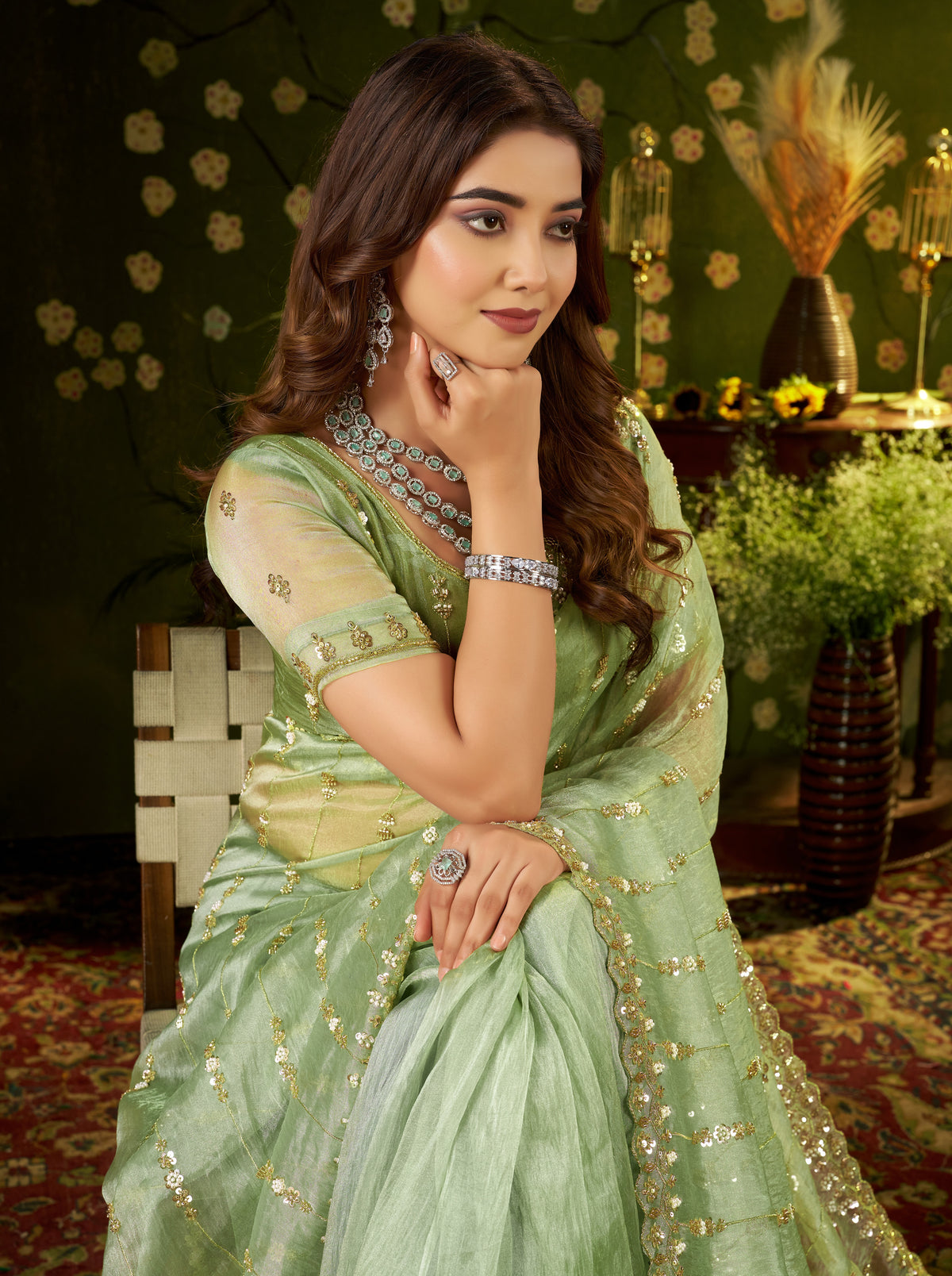 Mid-shot pose displaying the embellished scalloped border and floral handwork details on the blouse.