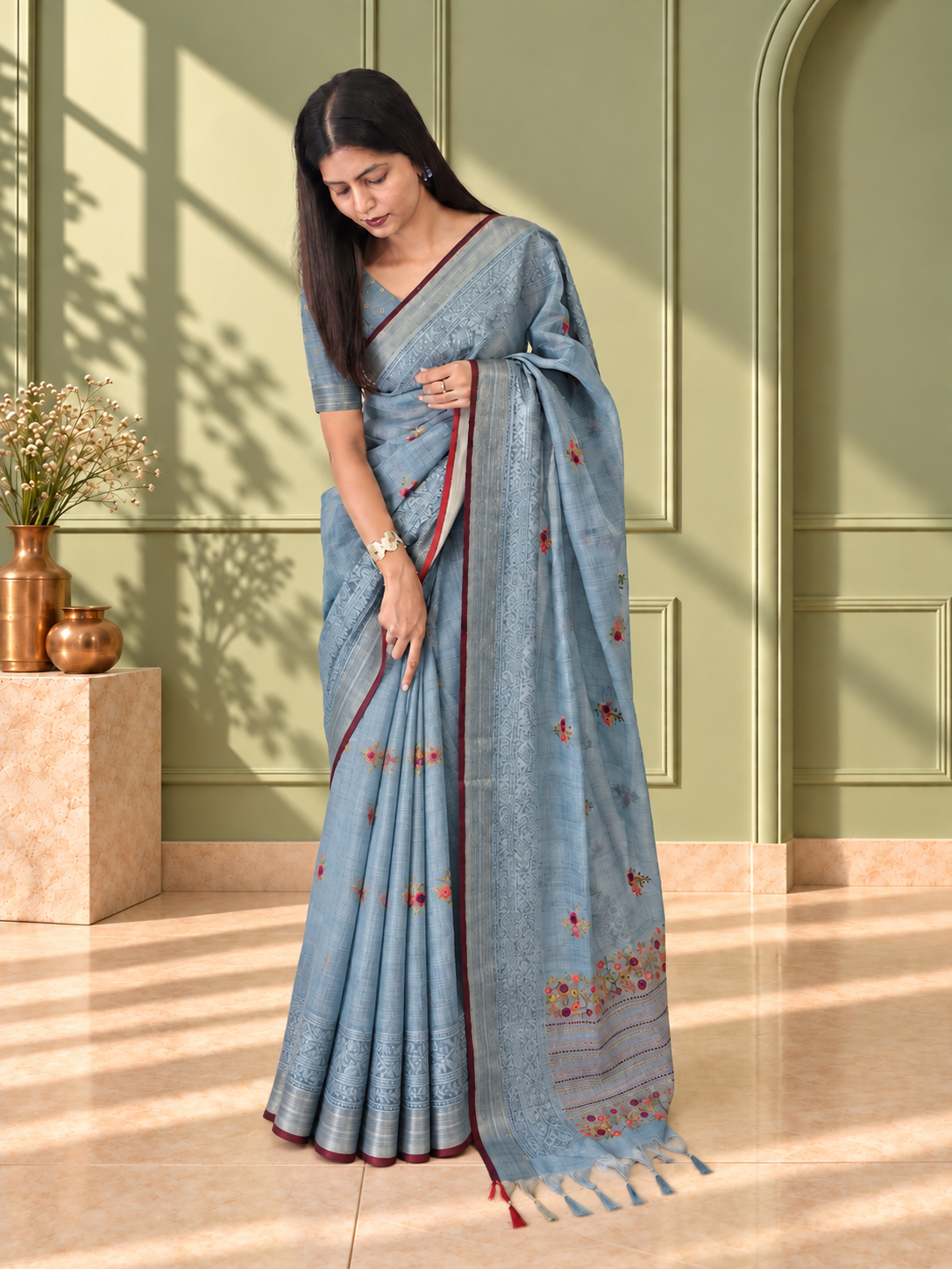 pastel blue linen saree with hand embroidered kantha work