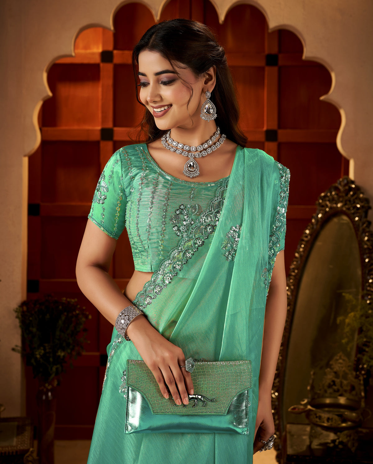 chhoga sea green floral motif saree pleats with elegant hand embellishments