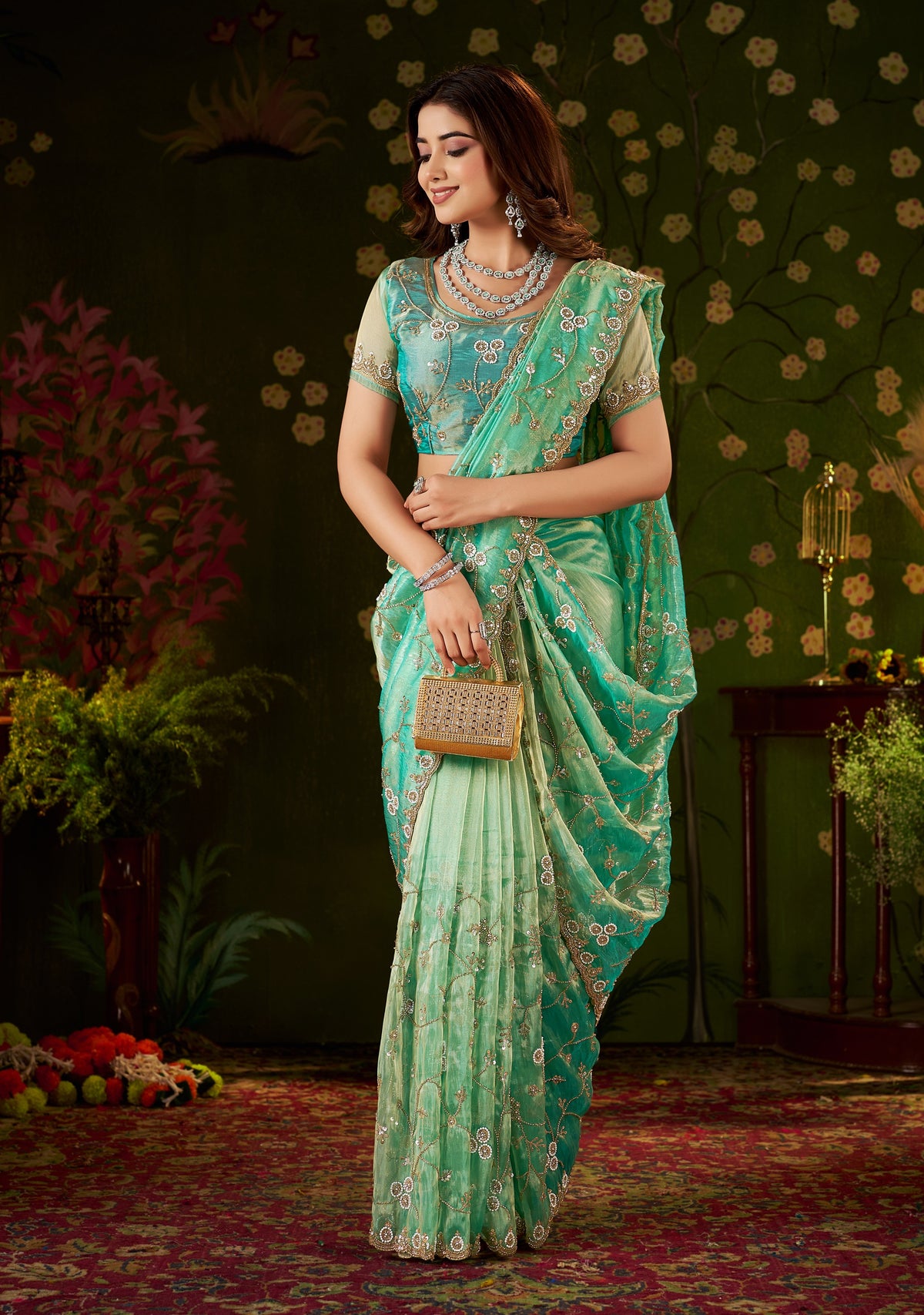 full view of chhoga sea green floral vine tissue silk saree with hand work