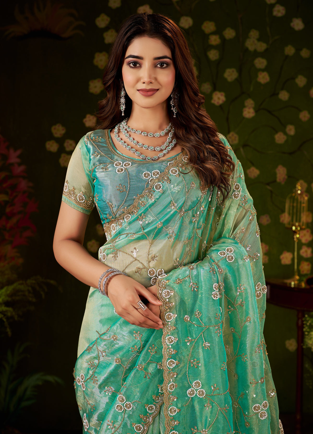 chhoga sea green hand work tissue silk saree in elegant half view