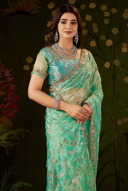 Close-up of the embellished scalloped border on Chhoga Sea Green Tissue Silk Saree