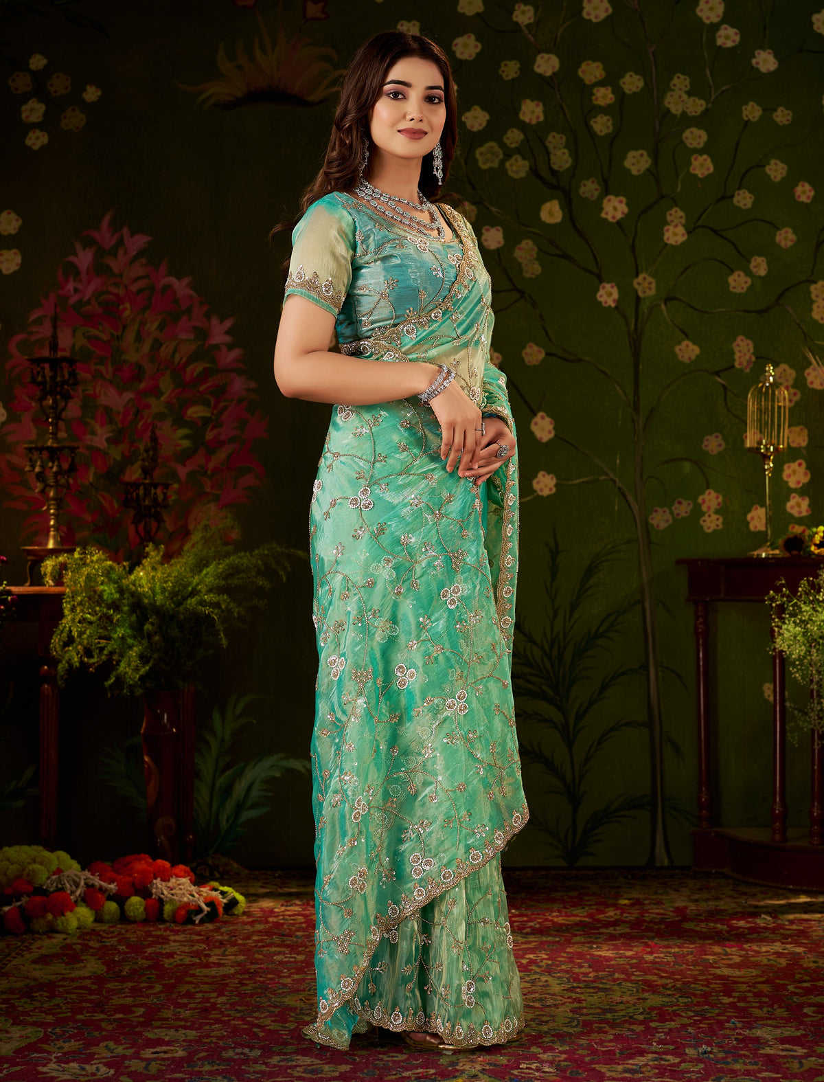 Side view of Chhoga Sea Green Tissue Silk Saree with embellished floral design