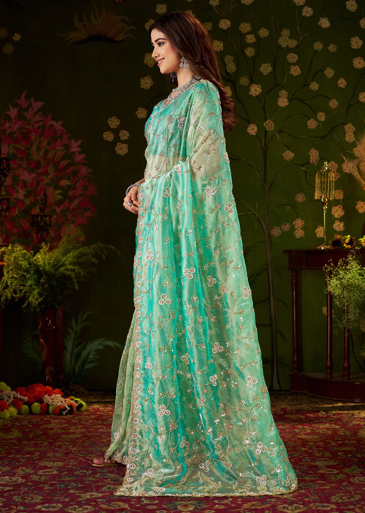 Stylish look of Chhoga Sea Green Tissue Silk Saree with floral vine hand work