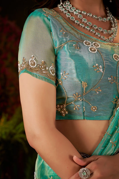 Matching unstitched Sea Green Tissue Silk blouse piece included with Chhoga saree